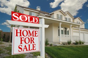 Home For Sale Sign in Front of Beautiful New Home