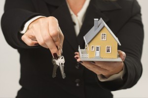 House and Keys in Female Hands